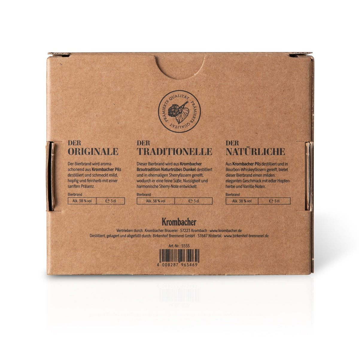 Rückseite braune Kartonverpackung mit drei Beschreibungen zu Krombacher Probierbrand-Sorten: Der Originale, Der Traditionelle, Der Natürliche, jeweils 5 cl, 38,5 % Vol.