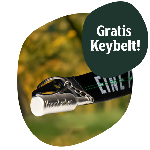 Schwarzes Schlüsselband mit grün-weißer Schrift und silbernem Metallclip mit Prägung 'Krombacher', Text 'Gratis Keybelt!'