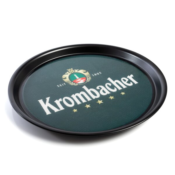 Rundes schwarzes Tablett mit grünem Einsatz, darauf das Krombacher-Logo mit Wappen, Schriftzug und fünf Sternen.