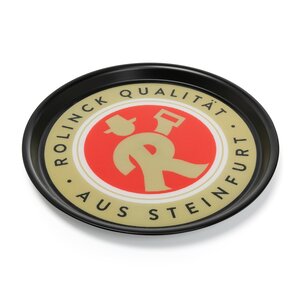 Rundes Tablett mit schwarzem Rand, beige-rotem Logo und Text 'ROLINCK QUALITÄT AUS STEINFURT'.