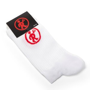 806069_Tennissocken_161_LR Ein Paar weiße Tennissocken mit rotem Rolinck Logo und schwarzer Verpackung mit rotem Rolinck Logo.
